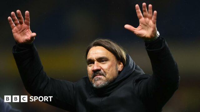 Daniel Farke with his arms raised towards the Leeds fans after the match