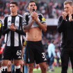 Eddie Howe and his Newcastle players salute their travelling fans after a 1-0 defeat at Arsenal