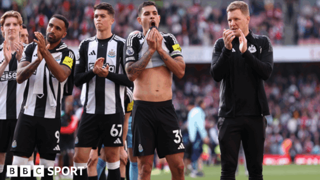 Eddie Howe and his Newcastle players salute their travelling fans after a 1-0 defeat at Arsenal