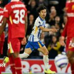 Kaoru Mitoma celebrates a goal