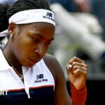 Coco Gauff clenches her fist after a winning a point against Mirra Andreeva