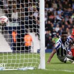 West Bromwich Albion's Daryl Dike hits the ground as he watches his header go into the goal against Luton Town