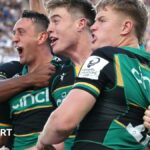 Alex Mitchell and his Northampton team-mates celebrate