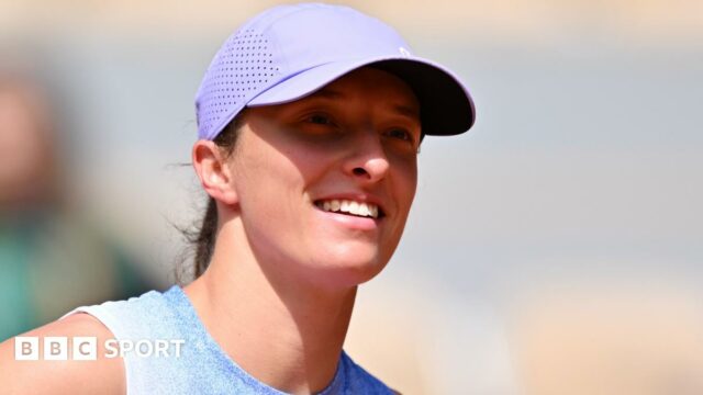 Iga Swiatek smiles after her first-round victory over Rebecca Sramkova in Paris
