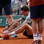 Ugo Humbert sits on the court after falling