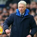 David Moyes keeps his eye on a ball as it bounces towards him in the technical area during a Premier League fixture