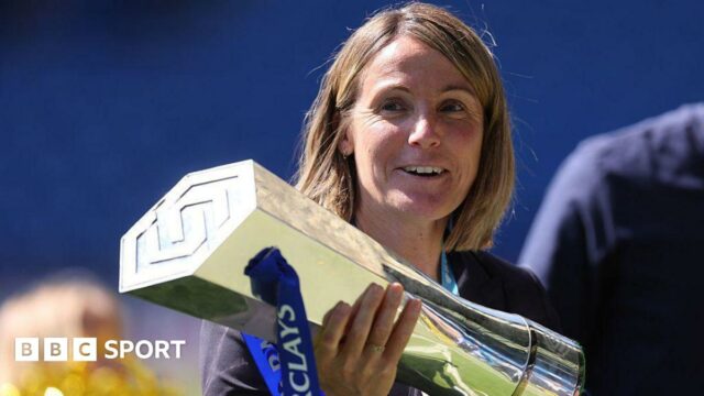 Chelsea manager Sonia Bompastor holds the WSL trophy