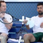 Andy Murray speaks to Novak Djokovic during the Australian Open