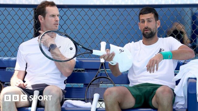 Andy Murray speaks to Novak Djokovic during the Australian Open