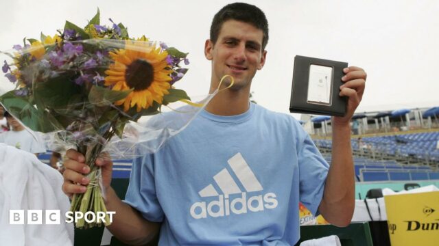 Novak Djokovic holds aloft his prizes for winning the Dutch Open in July 2006