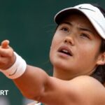 Emma Raducanu of Great Britain in action against Xinyu Wang of China at French Open.