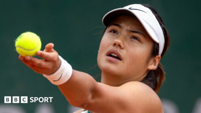 Emma Raducanu of Great Britain in action against Xinyu Wang of China at French Open. 