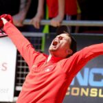 A Leyton Orient fan celebrates in the crowd
