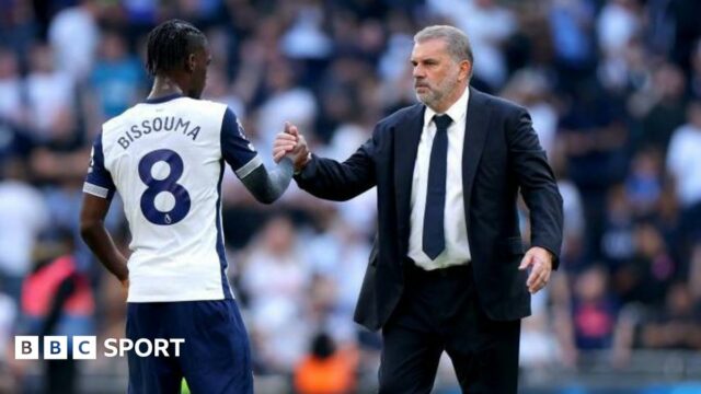 Yves Bissouma (left) shakes hands with Tottenham manager Ange Postecoglou