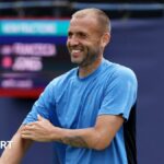 Dan Evans plays a backhand