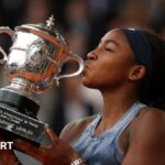 Coco Gauff kisses the French Open trophy