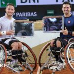 Alfie Hewett and Gordon Reid with the men's wheelchair doubles trophy