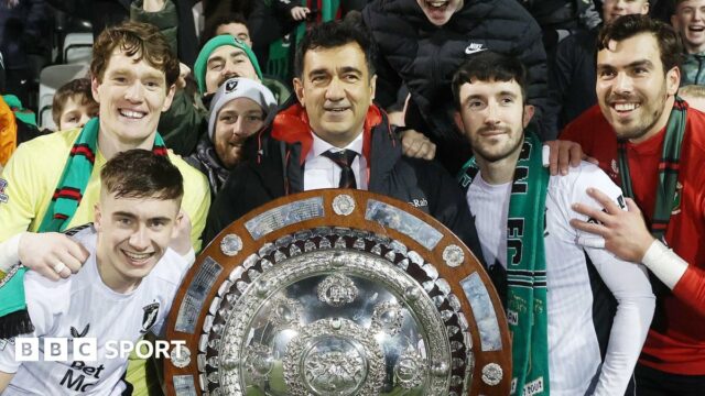 Ali Pour (centre) celebrates Glentoran's County Antrim Shield victory last season