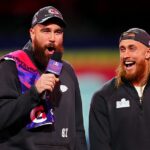 Hviezda NFL George Kittletle (vpravo) zdvihla veko Swift's Shock Show na Nashville