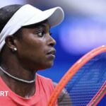 Sloane Stephens holding a tennis racquet