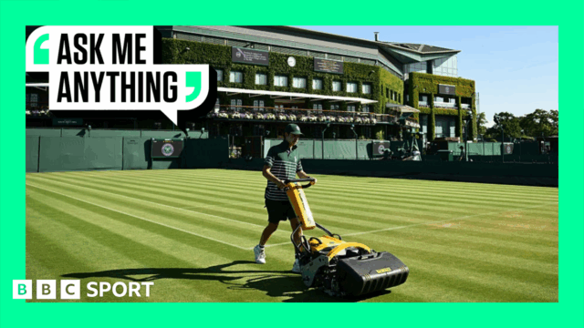 A groundskeeper mowing a court a Wimbledon