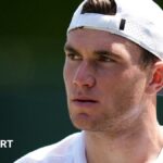 Jack Draper looks on during a practice session at Wimbledon