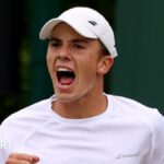 Oliver Tarvet serves the ball at Wimbledon qualifying