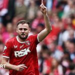 Macaulay Gillesphey celebrating his goal in the League One play-off final win over Leyton Orient last season