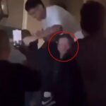 Tréner St. Kilda Ross Lyon (s kruhom) zobrazoval zápasovú hviezdu Nasiah Wanganeen-Milera, ktorý po víťazstve nad Melbourne chytí divokú párty tímu z videa