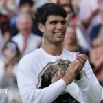 Carlos Alcaraz interacting with fans on court 14 before the Wimbledon final