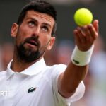 Novak Djokovic serves