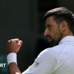 Novak Djokovic clenches his fist at Wimbledon