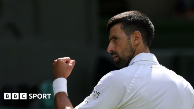 Novak Djokovic clenches his fist at Wimbledon