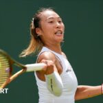 Zheng Qinwen playing at Wimbledon in July 2025