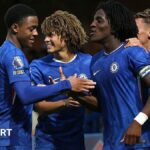 Ryan Kavuma-McQueen celebrates a Chelsea goal against Manchester City with Shumaira Mhueka