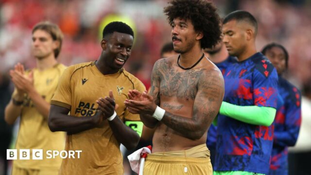 Marc Guehi and Chris Richards applaud the Crystal Palace fans