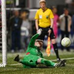 Luke Dennison saves a penalty