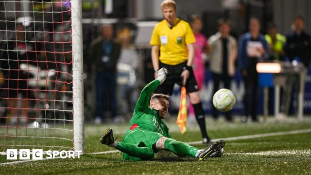 Luke Dennison saves a penalty