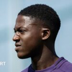 Kobbie Mainoo of Manchester United in action during a first team training session