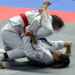 Kayla Napolis (na zemi) čelí menšej bitke o zlatú medailu. —Potovateľné prispelo