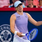 Iga Swiatek reacts during her match with Clara Tauson