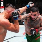 5. októbra 2024; Salt Lake City, Utah, Spojené štáty; Roman Dolidze (červené rukavice) reaguje po porážke Kevina Hollandu (nezobrazené) počas UFC 307 v centre Delta. Povinný kredit: Stephen R. Sylvanie-Imagn Pictures