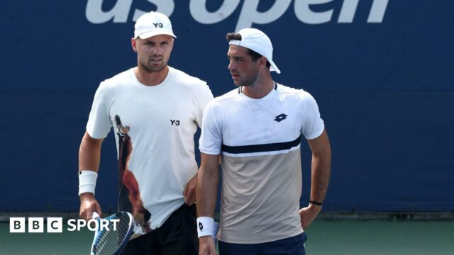 Lloyd Glasspool and Julian Cash playing in their first-round doubles match at the US Open in New York