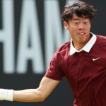 Coleman Wong hits a forehand at the US Open