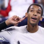 Felix Auger-Aliassime cups his ear at the US Open