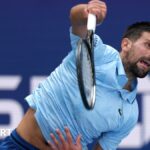 Novak Djokovic serves in the second round of the US Open
