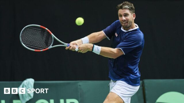Cameron Norrie playing tennis for Great Britain against Poland's Tomasz Berkieta in Davis Cup in Gdynia, Poland