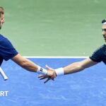 Julian Cash and Lloyd Glasspool shake hands during Davis Cup doubles match against Poland