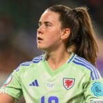 Esther Morgan wears a green Wales team shirt