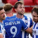 Coleraine players celebrate Will Patching's opening goal